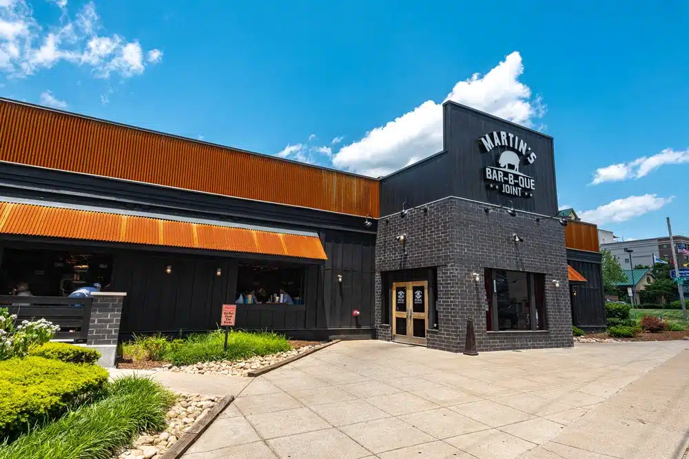 A black and brown building having Martin's Bar B-Que joint in white at the front