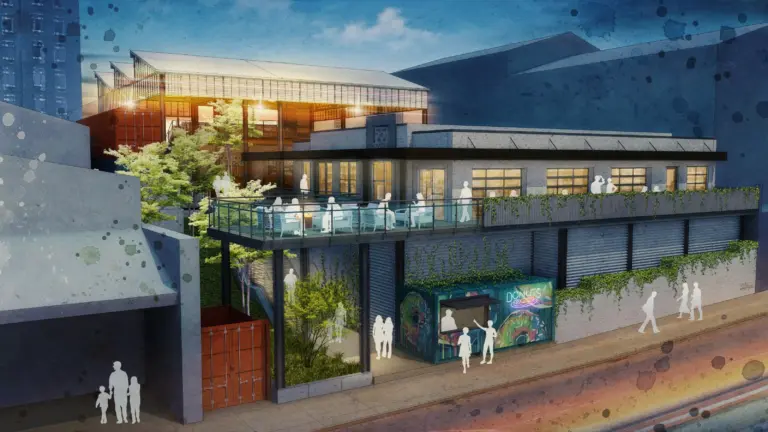 A graphical view of the hospitality building with people interacting on the terrace and a donut container outside of the building.