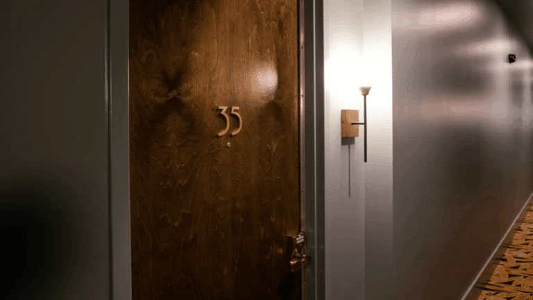 The artful blend of adaptive reuse and hospitality design come together in our historic downtown hotel renovation at the iconic Woolworth on 5th building for a high-end Airbnb.